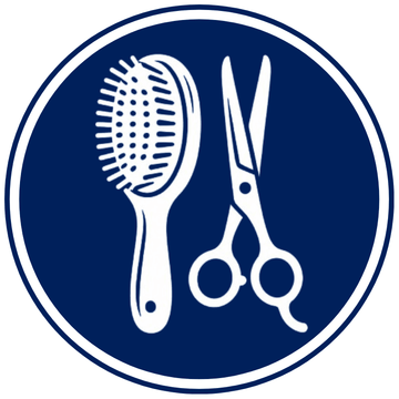 Professional pet grooming tools including brushes, combs, and grooming accessories